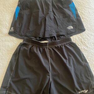 2 pair of north face flight series and saucony shorts